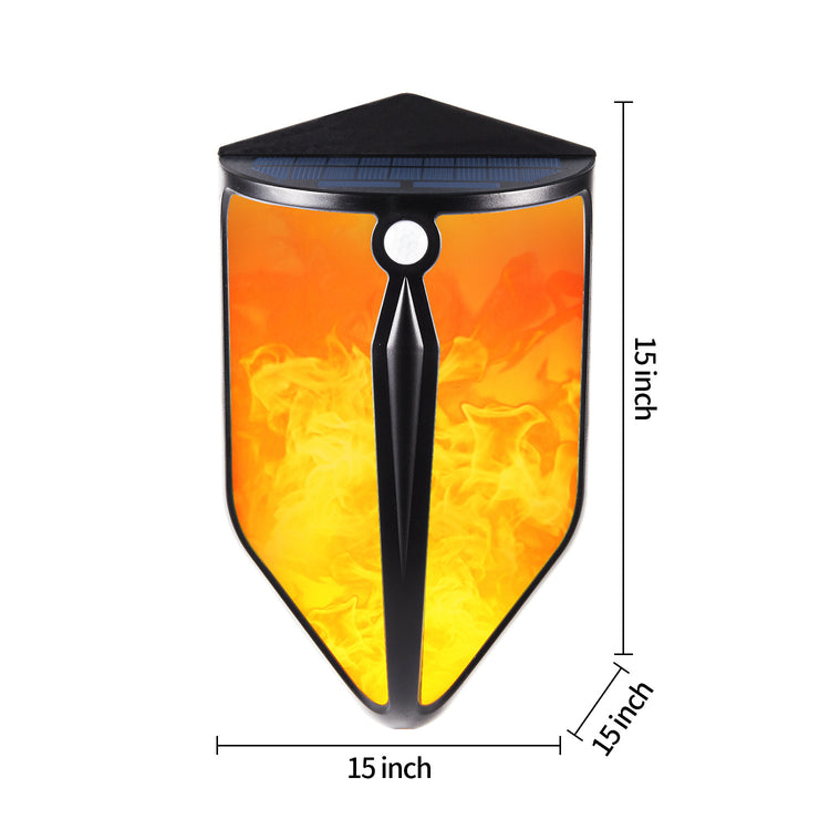 a small black and yellow object with a black triangle with a yellow and orange design