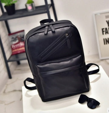 a black backpack on a white table