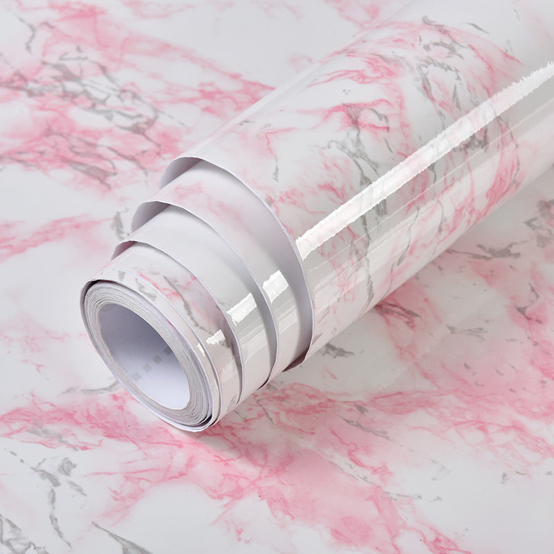 a roll of pink and white marbled paper