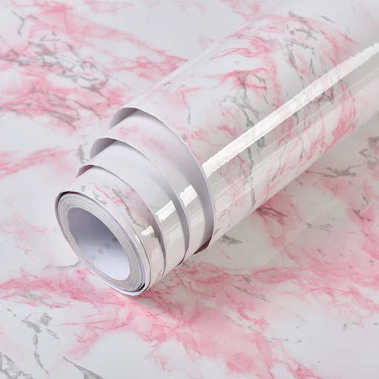 a roll of pink and white marbled paper