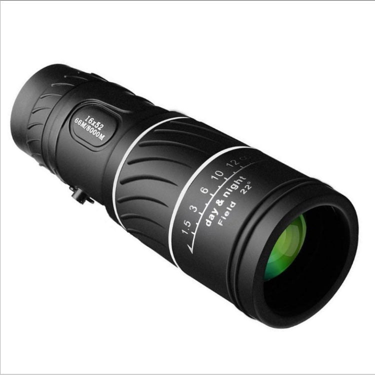 a black telescope with a green lens