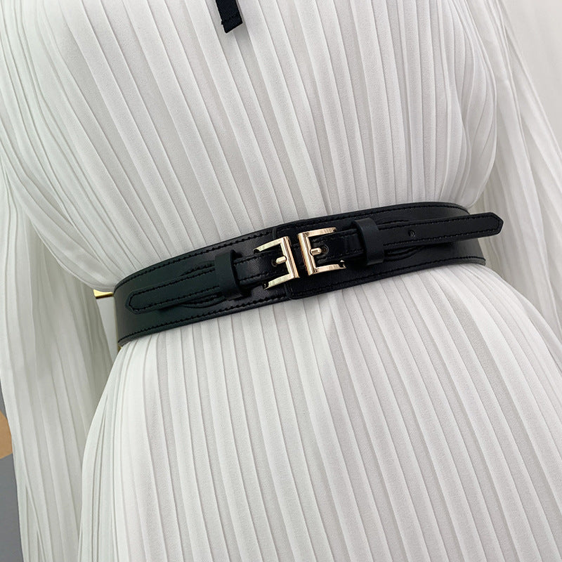 a black belt on a white dress
