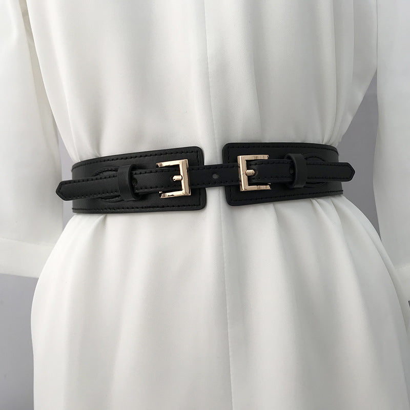 a black belt on a white dress