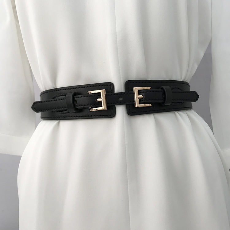 a black belt on a white dress