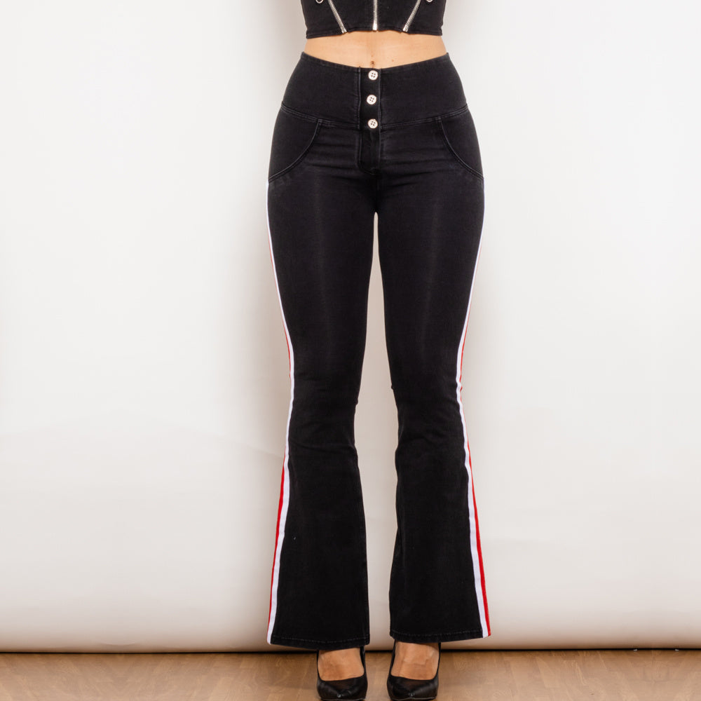 a woman wearing black pants and a top