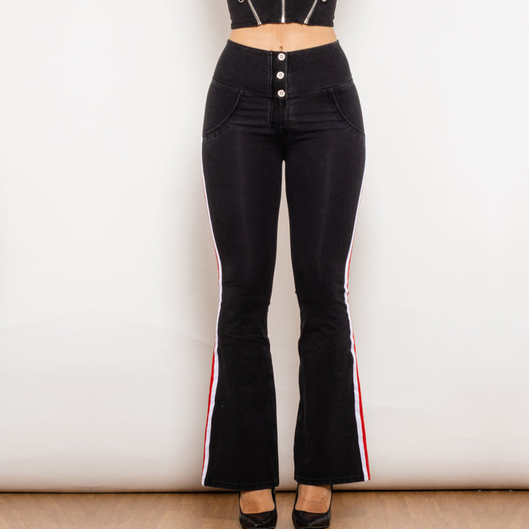 a woman wearing black pants and a top