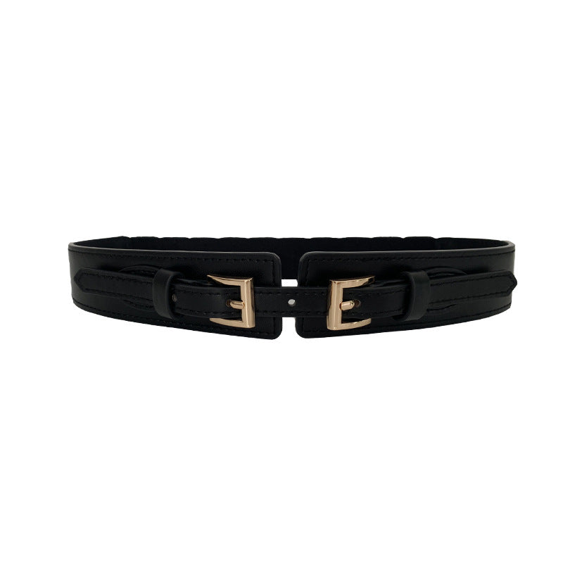 a black belt with gold buckles