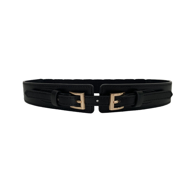a black belt with gold buckles