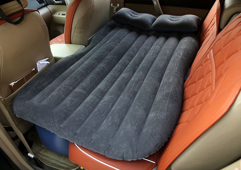 a black inflatable mattress in a car