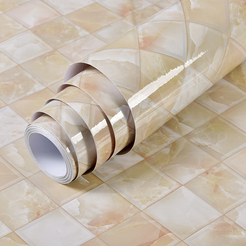 a roll of wallpaper on a tile floor