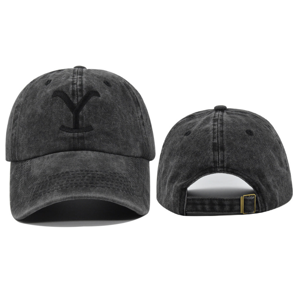 a black hat with a letter on it