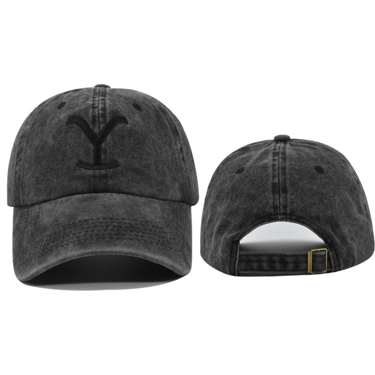 a black hat with a letter on it