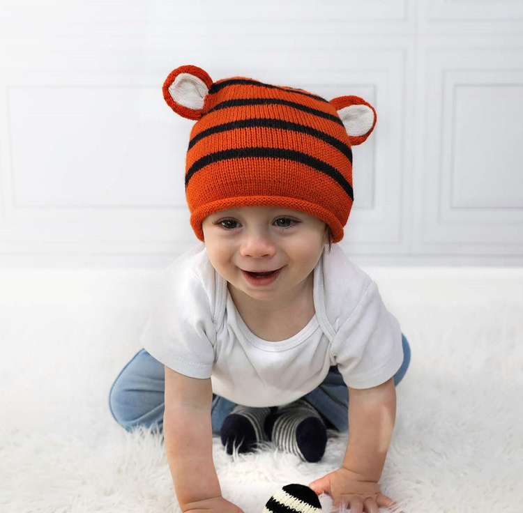a baby wearing a knit hat