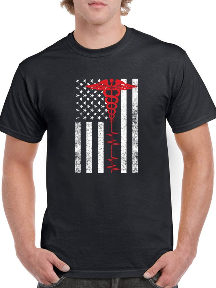 a man wearing a black shirt with a flag and a caduceus on it