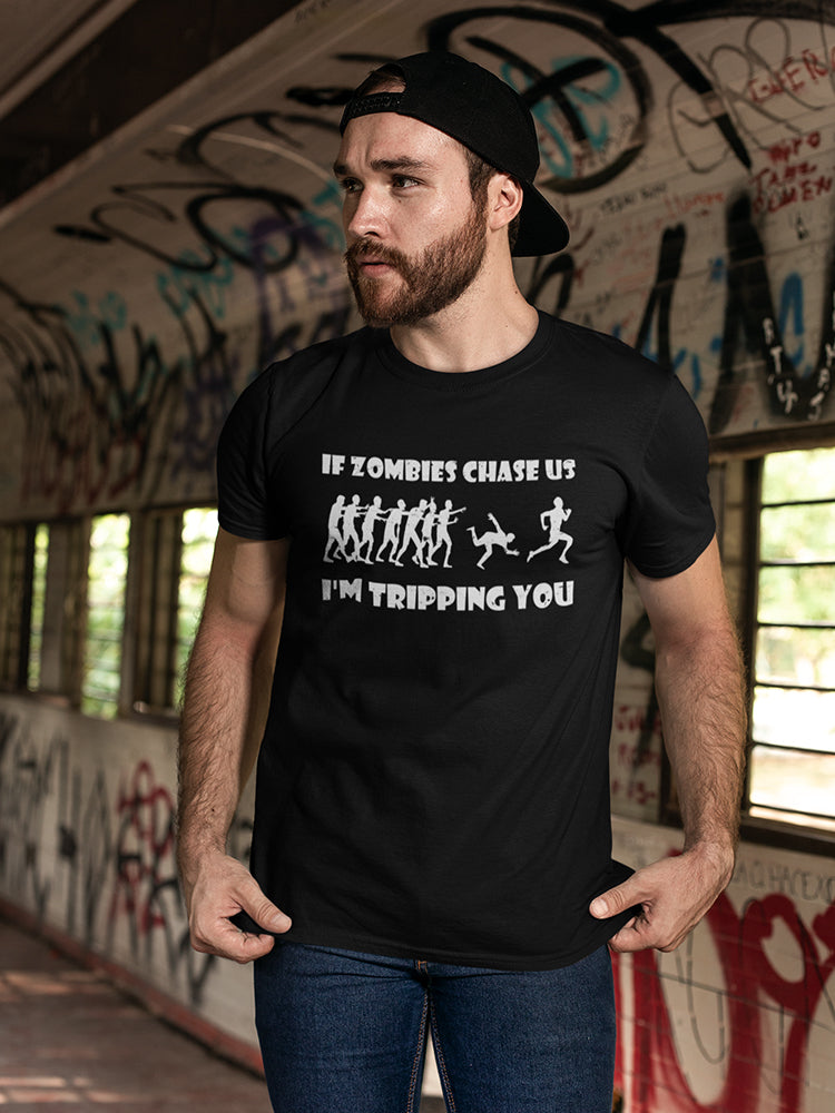a man wearing a black hat and a black shirt with white text