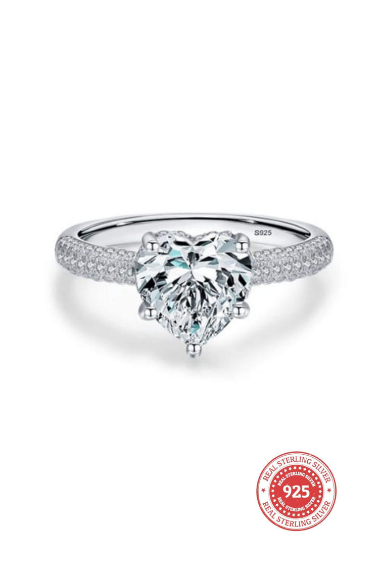 a diamond ring with a heart shaped stone