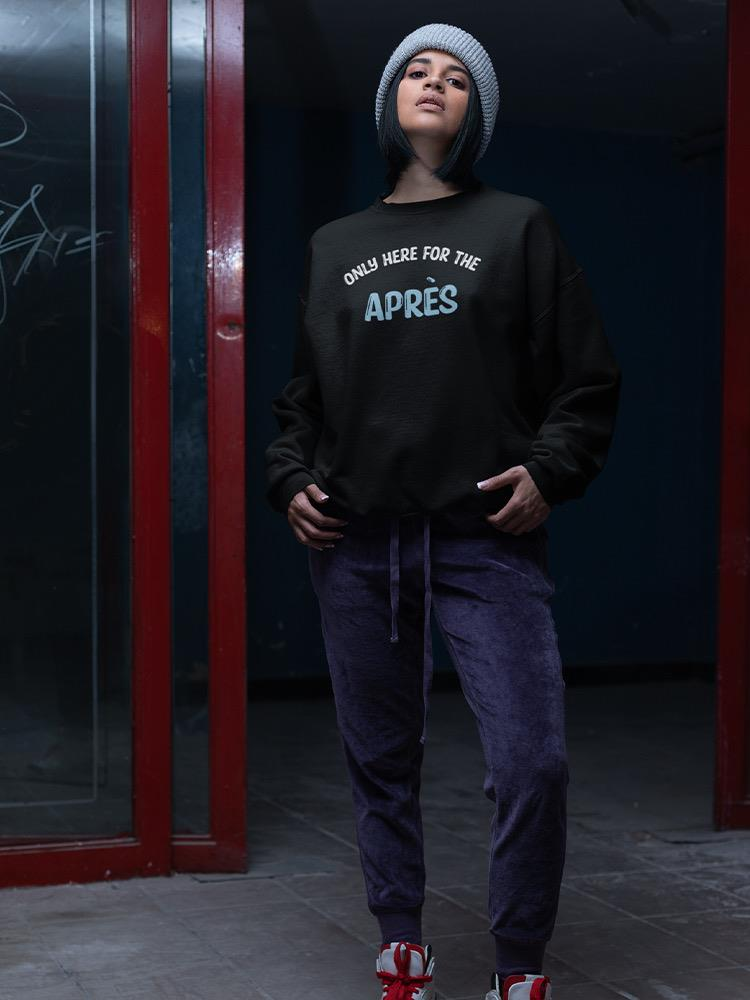 a woman with blue hair wearing a black sweatshirt and purple pants