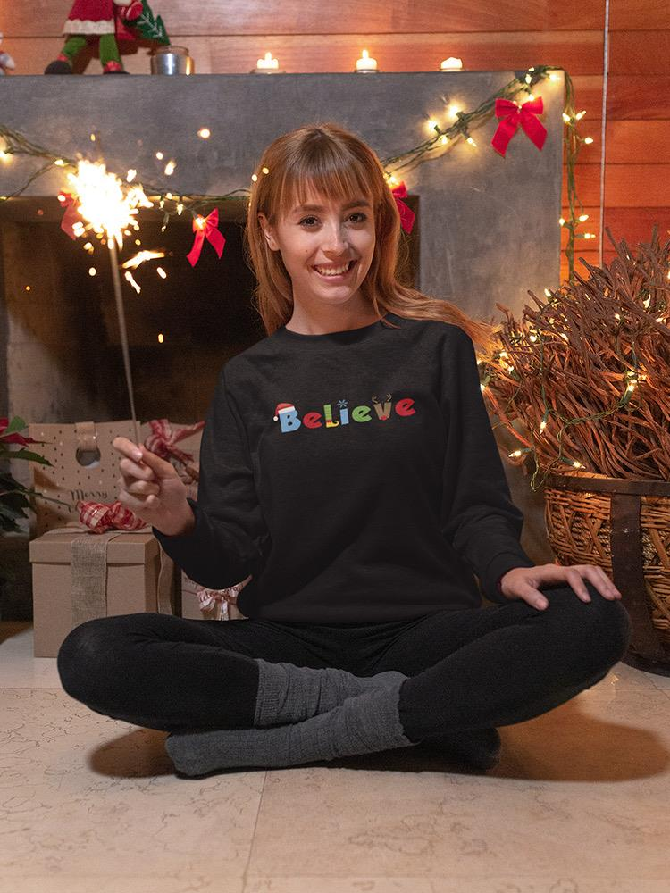 a woman sitting cross legged in front of a fireplace