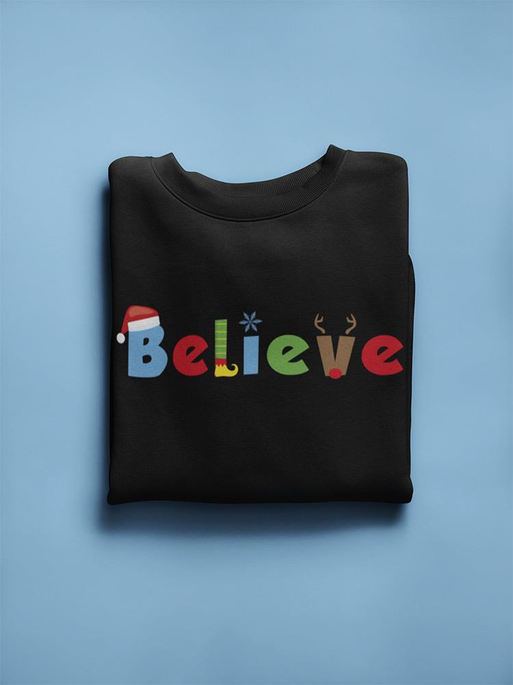 a folded black sweatshirt with colorful letters on it