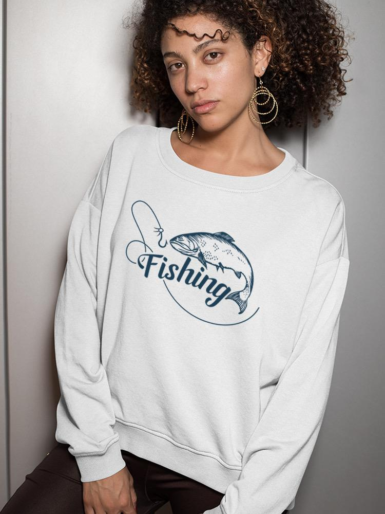 a woman with curly hair wearing a white sweatshirt