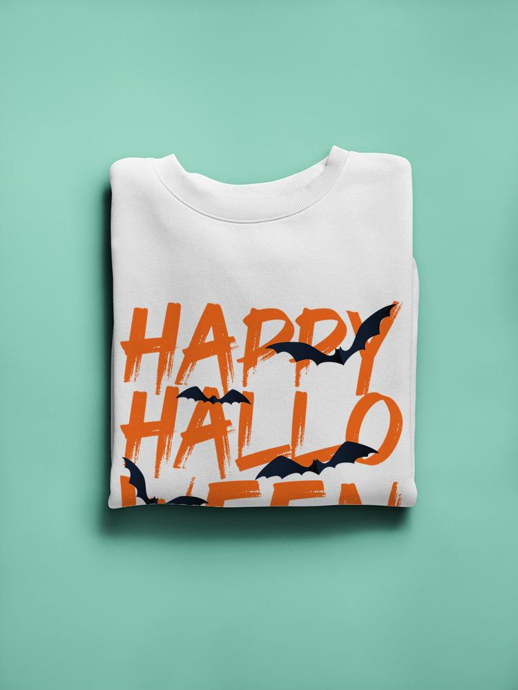 a folded white shirt with orange text and bats on it
