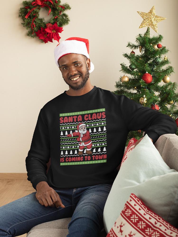 a man wearing a santa hat and sitting on a couch
