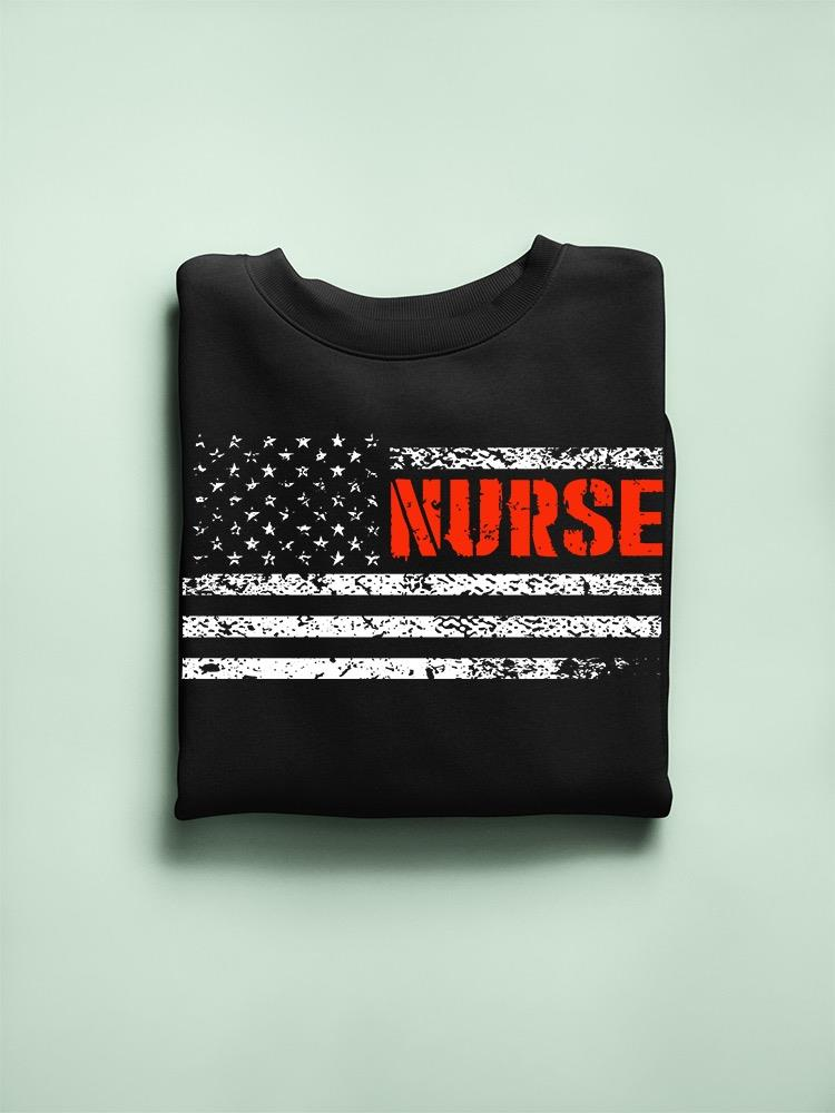 a folded black sweatshirt with a flag on it