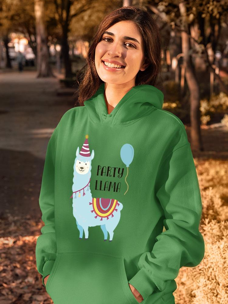 a woman wearing a green sweatshirt