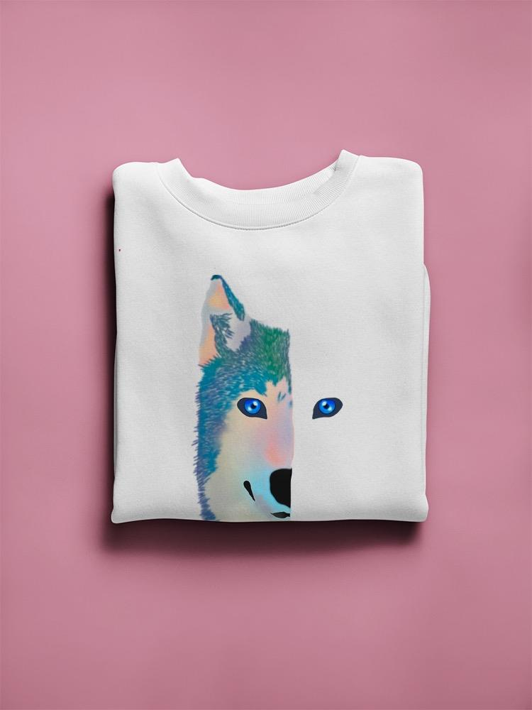 a white folded shirt with a wolf face on it