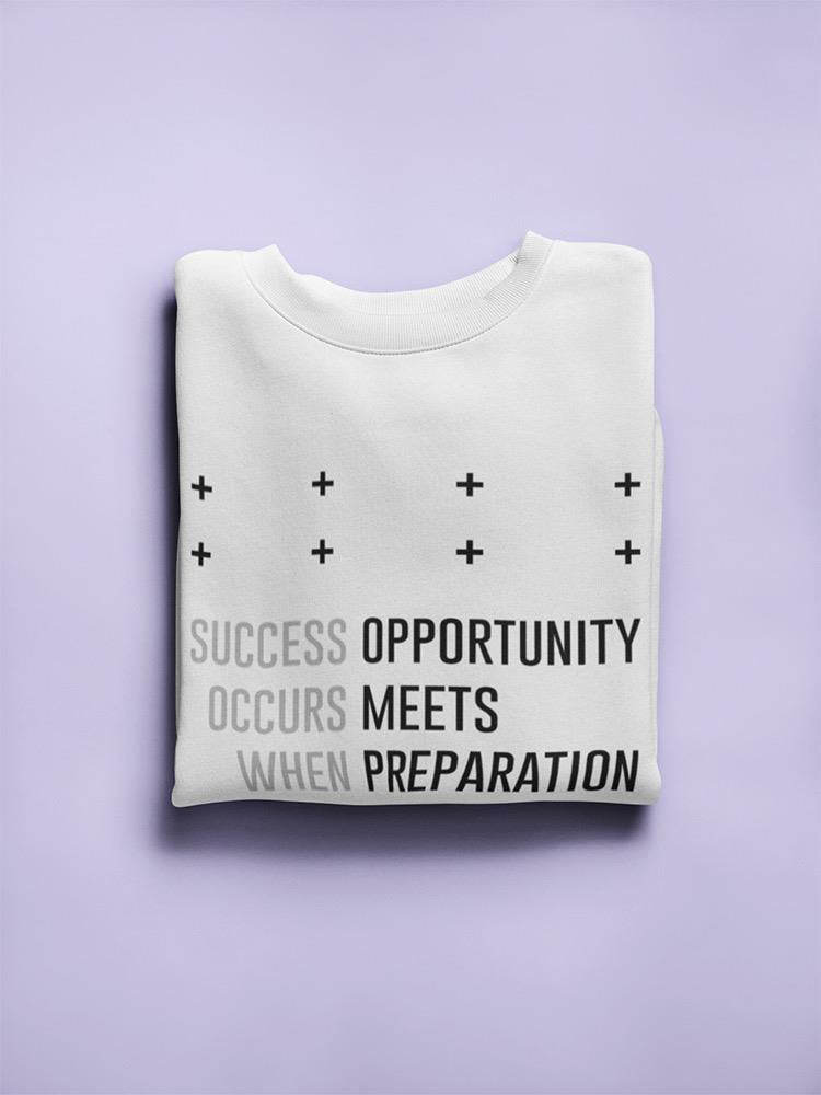 a folded white shirt with black text