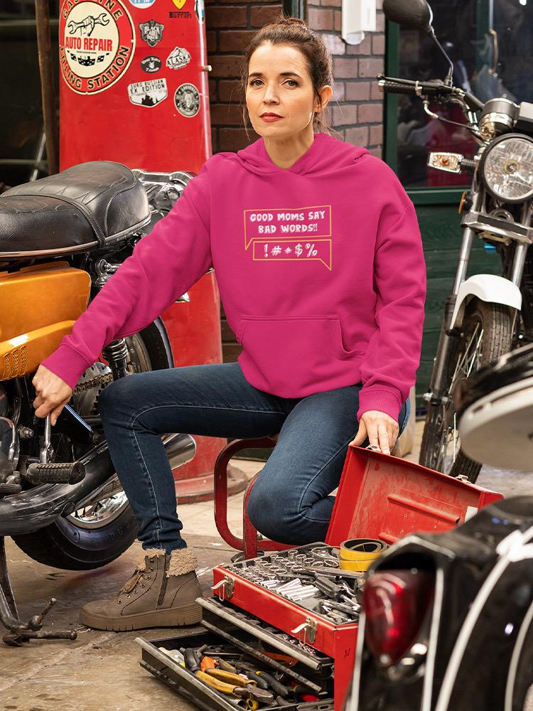 a woman sitting on a chair with a toolbox