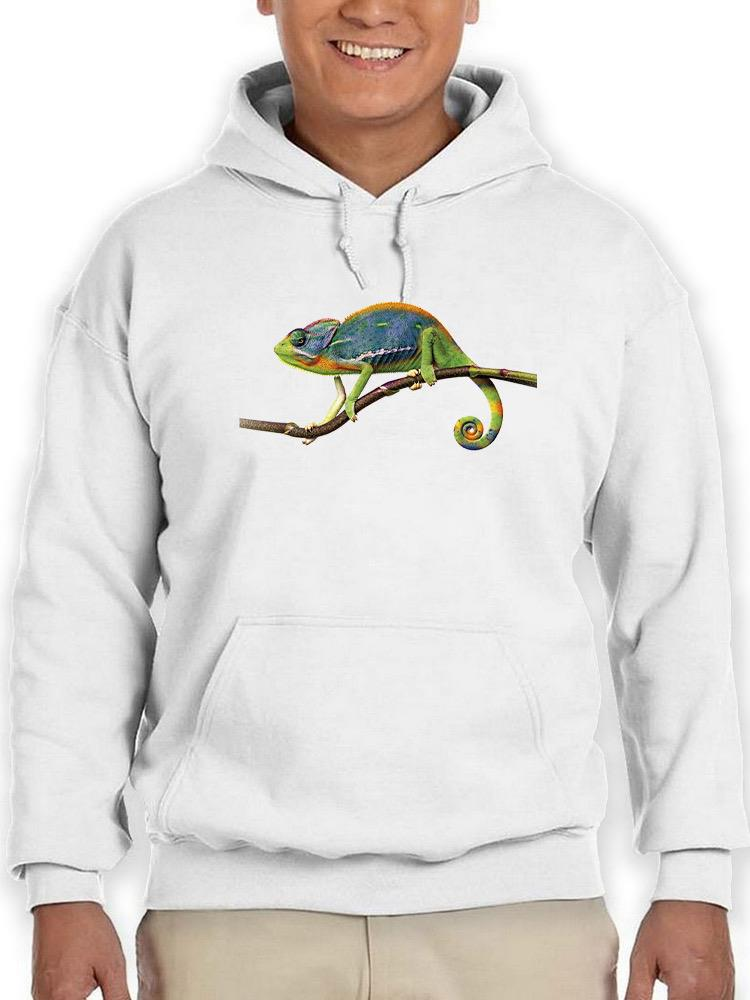 a person wearing a white hoodie with a chameleon on a branch