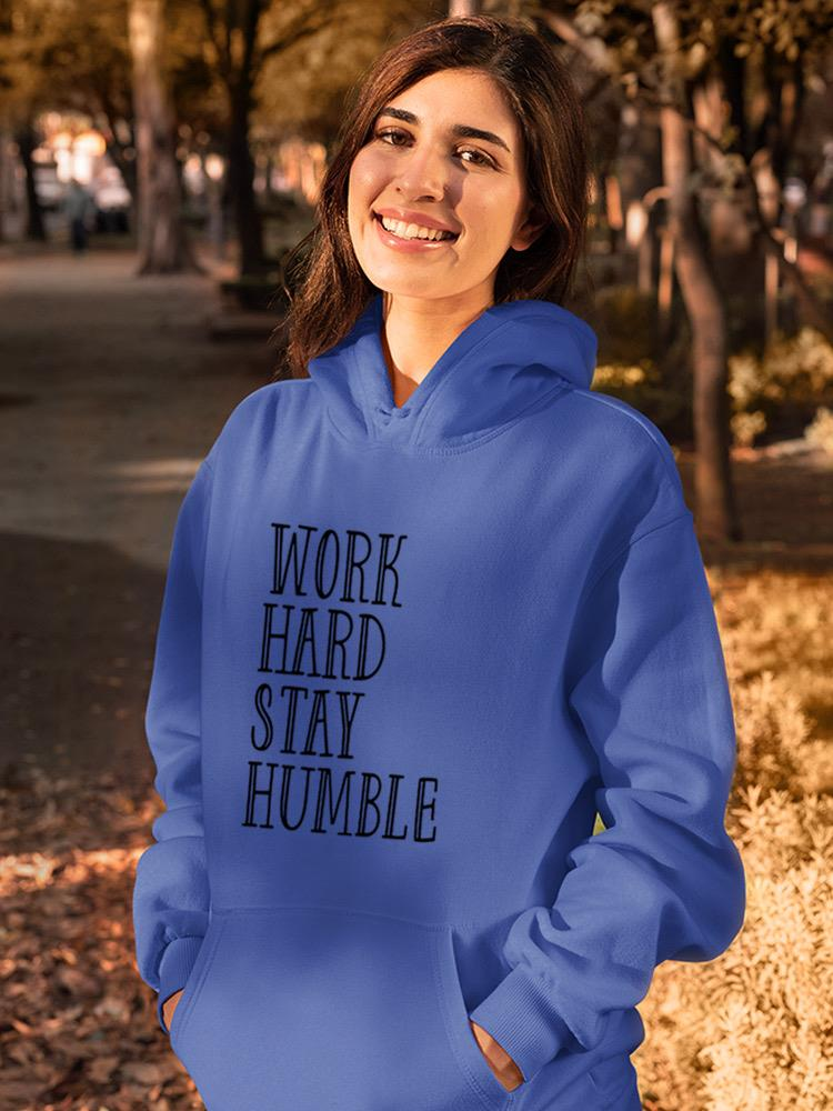 a woman in a blue sweatshirt