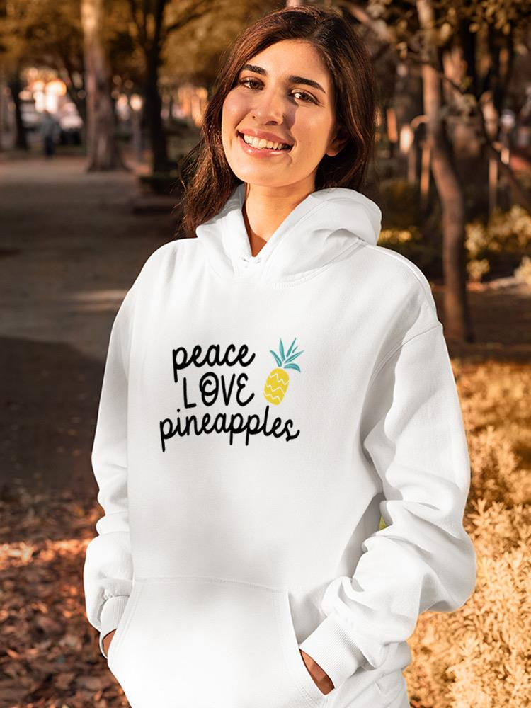 a woman smiling in a white sweatshirt