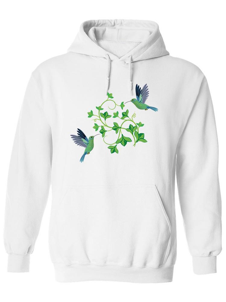 a white sweatshirt with green leaves and birds on it