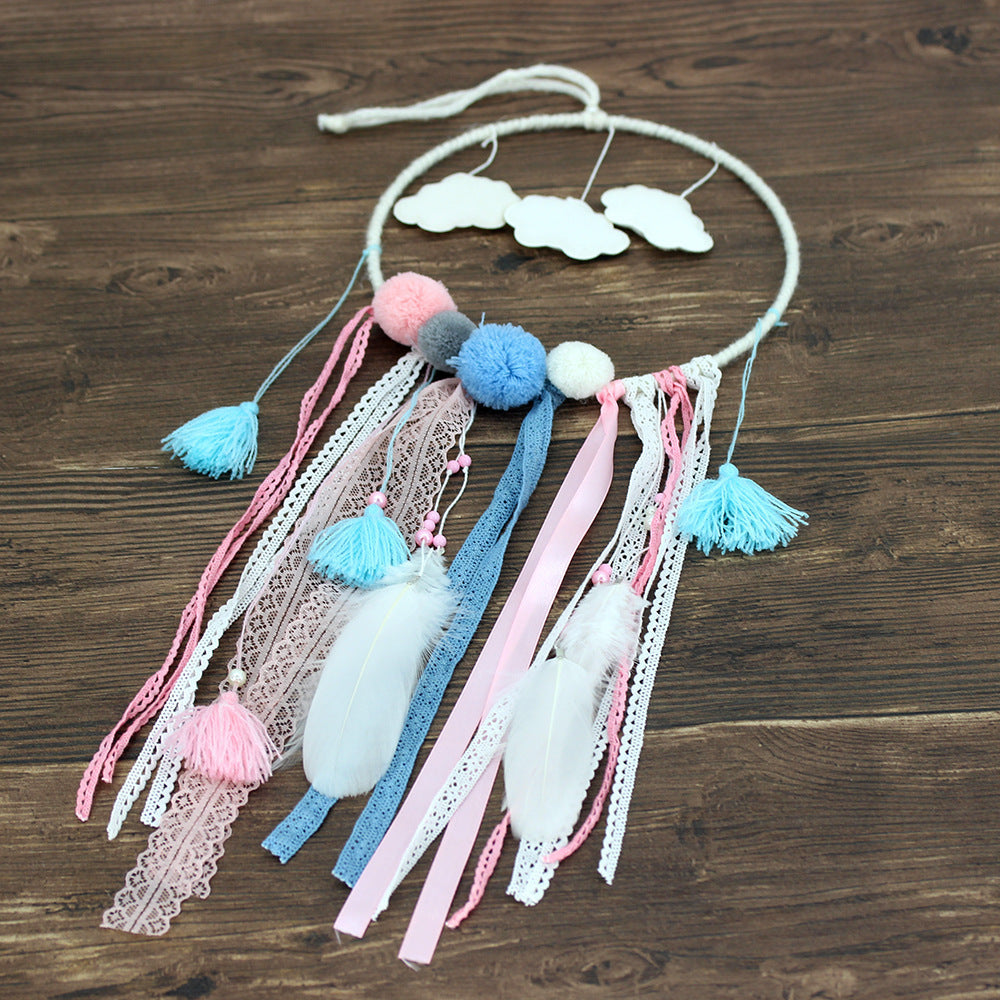 a dream catcher on a wood surface