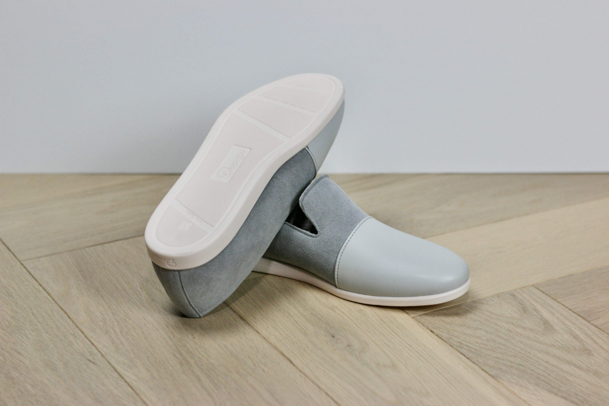 a pair of grey shoes