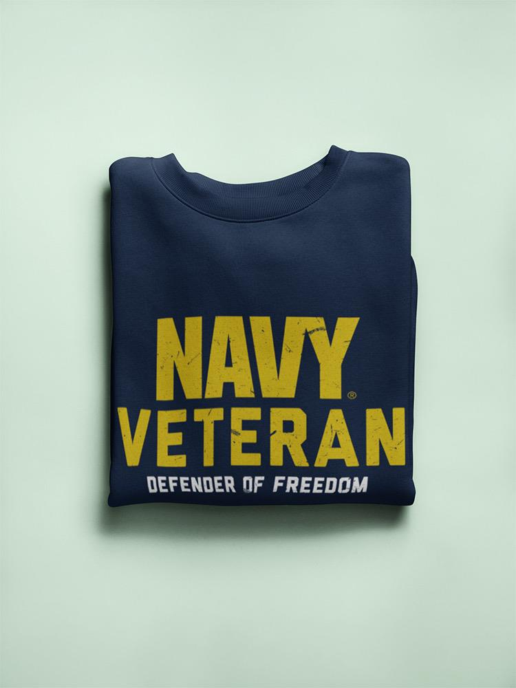 a folded navy sweater with yellow text