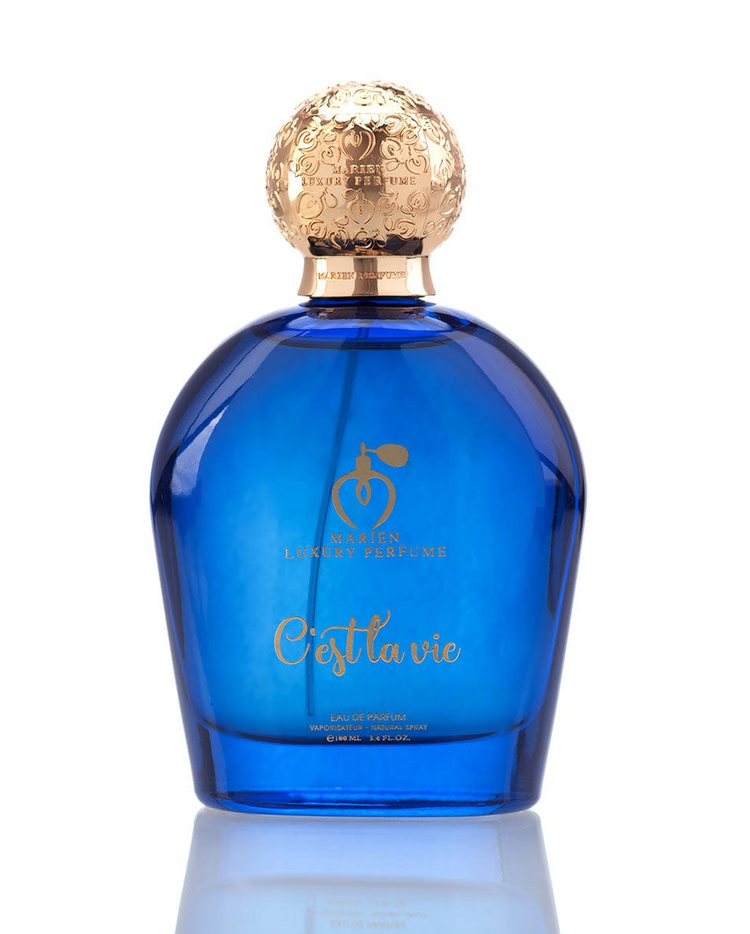 a blue bottle with gold cap