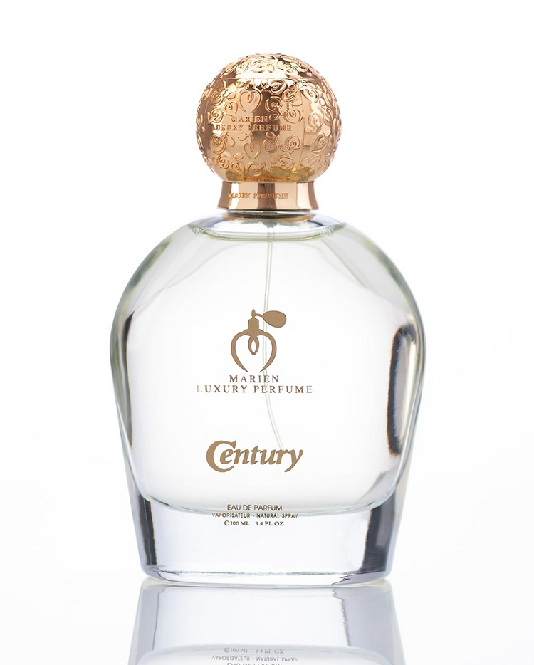 a bottle of perfume with a gold cap
