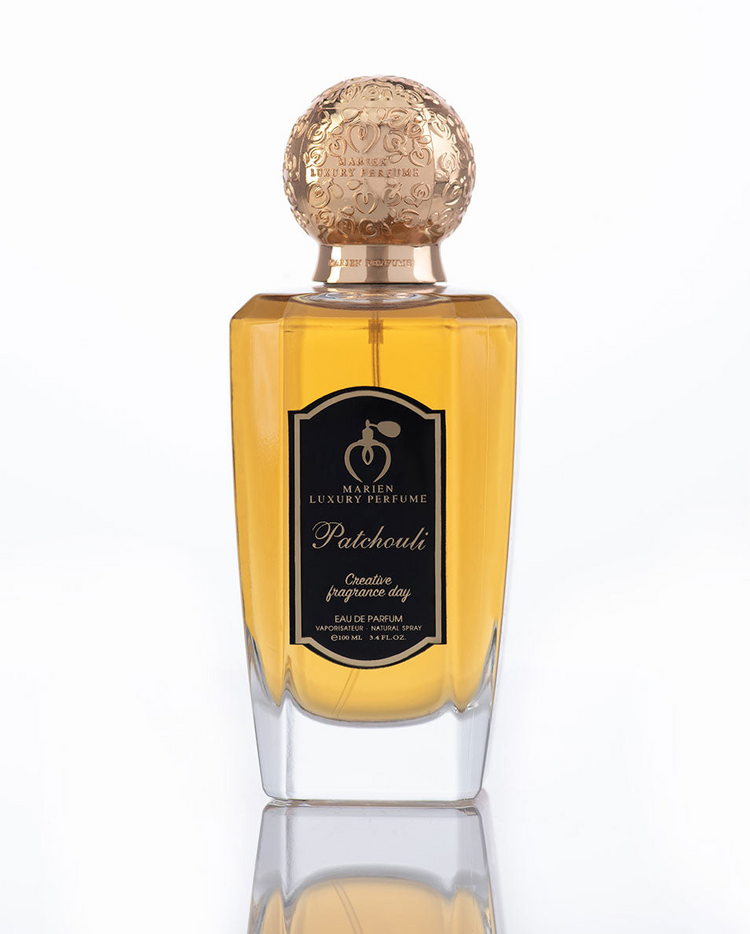 a bottle of perfume with a gold cap