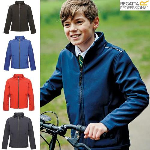 a boy standing on a bicycle