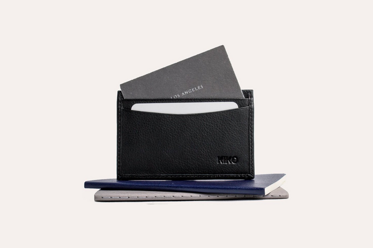 a black wallet with a card inside