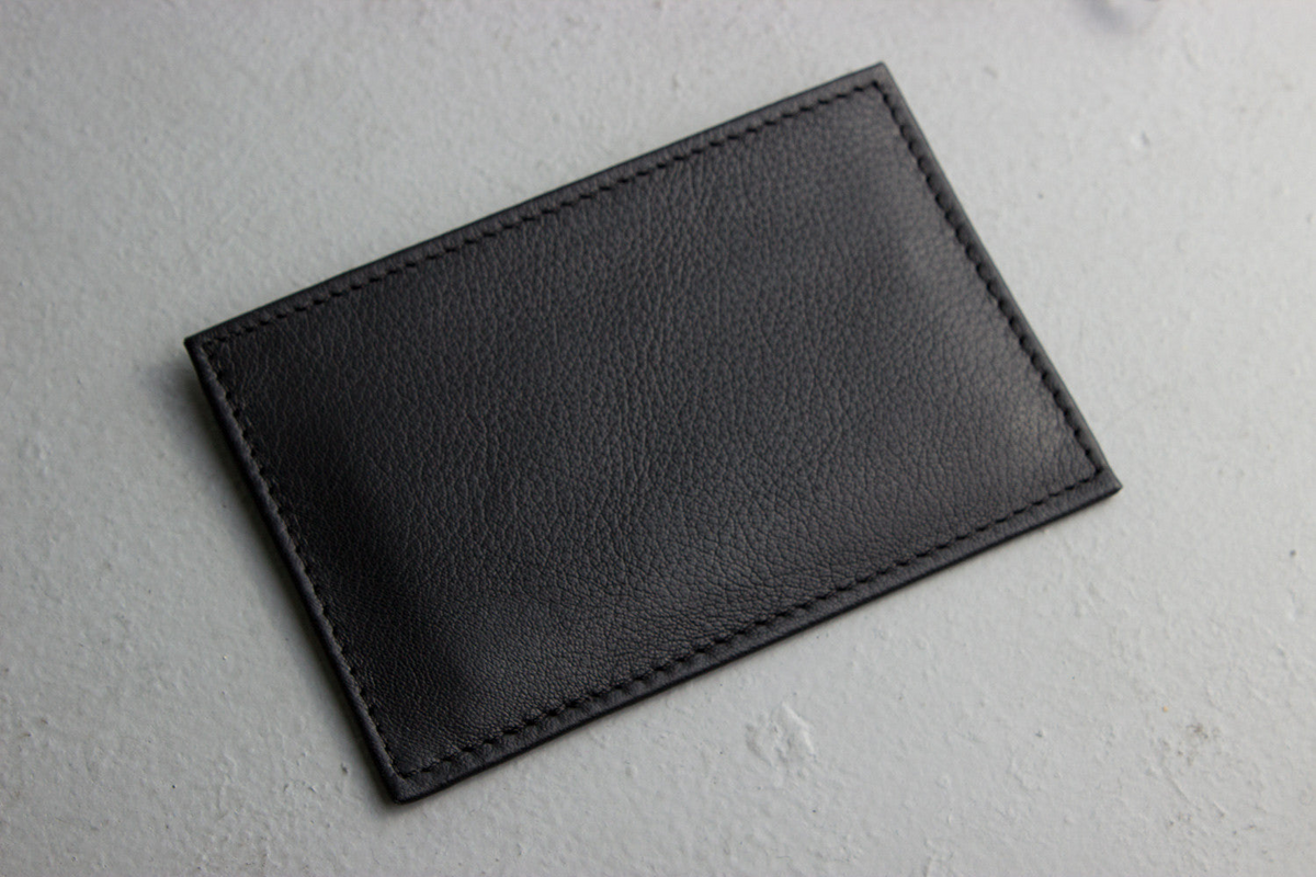 a black leather card holder