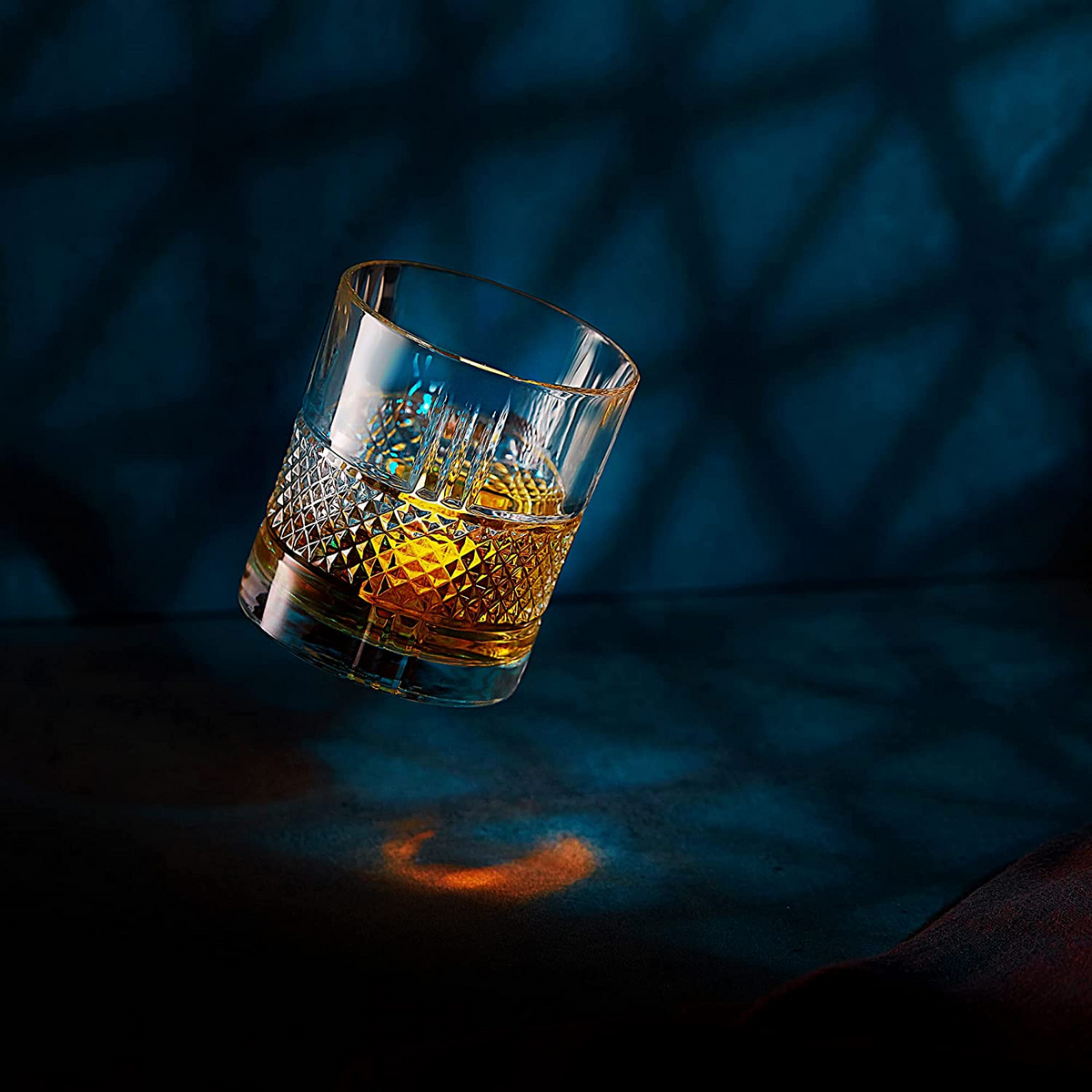 a glass of alcohol in the air