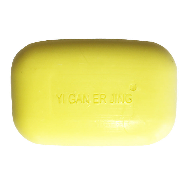 a yellow soap with writing on it