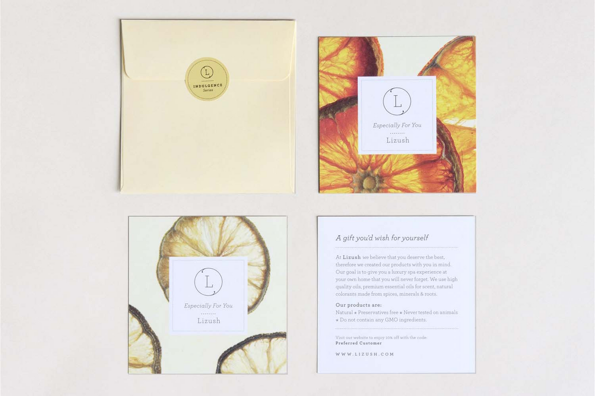 a group of envelopes with orange slices and a note