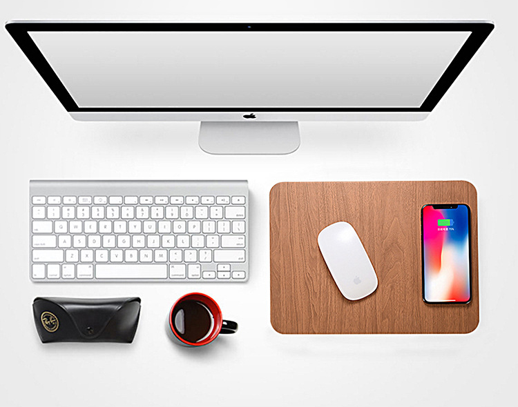 a computer monitor and a mouse and a cup of coffee