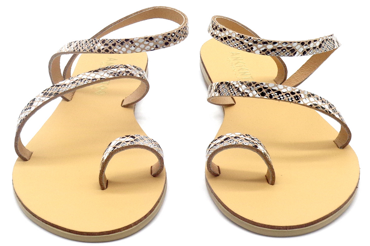 a pair of sandals with snakeskin design