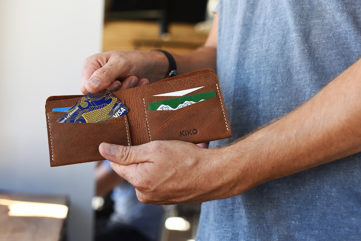 a person holding a wallet